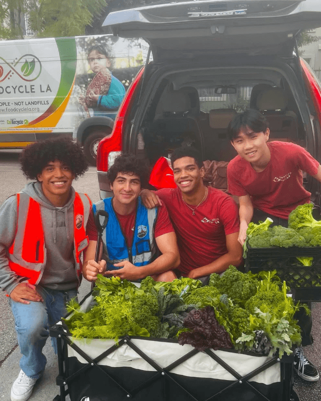 FeelingFullLA volunteers with rescued greens at a FoodCycle LA pickup